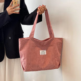Große Kapazität Damen Umhängetasche 2023 Neue modische frische und einfache gestreifte Samthandtasche Kunst Freizeit Student Einkaufstasche